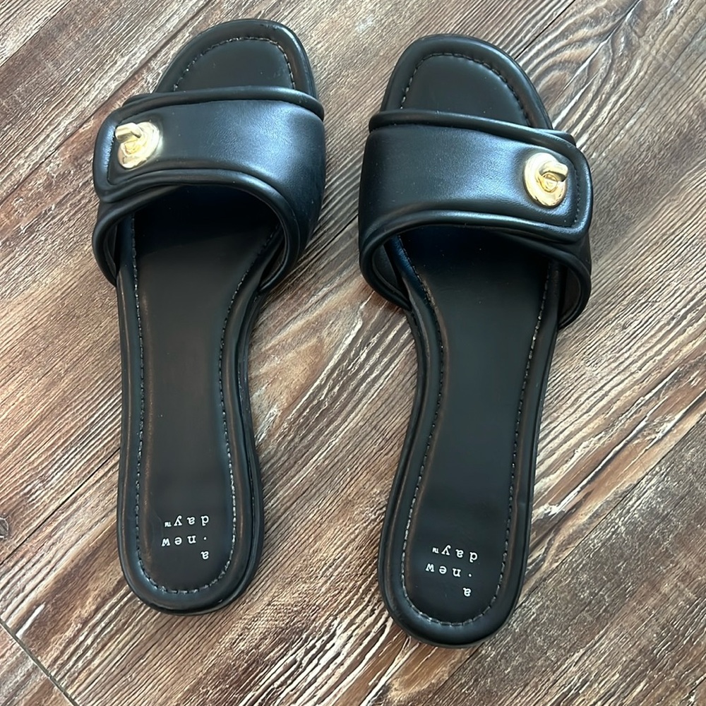 Worn once, black slides with gold details